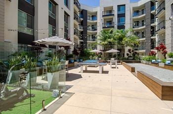 Courtyard with outdoor games including bocce ball